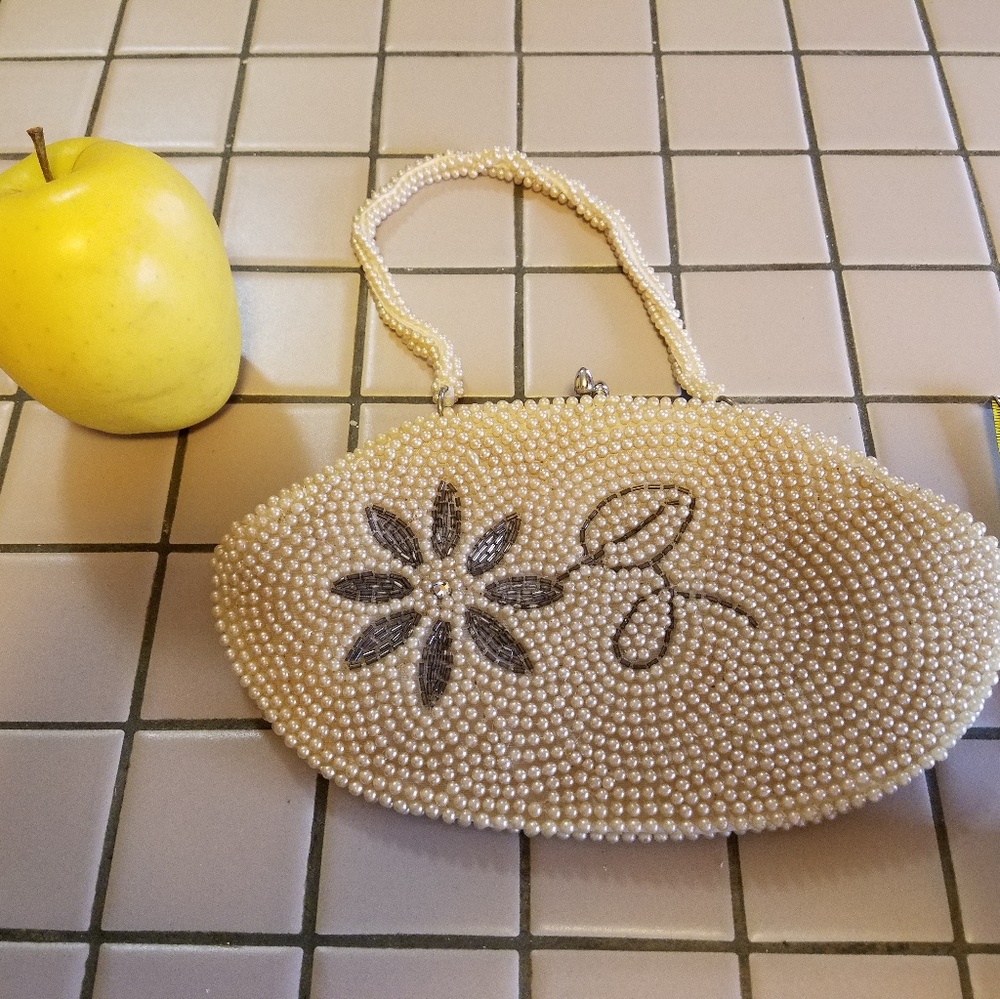 Vintage seed pearl wristlet style purse.